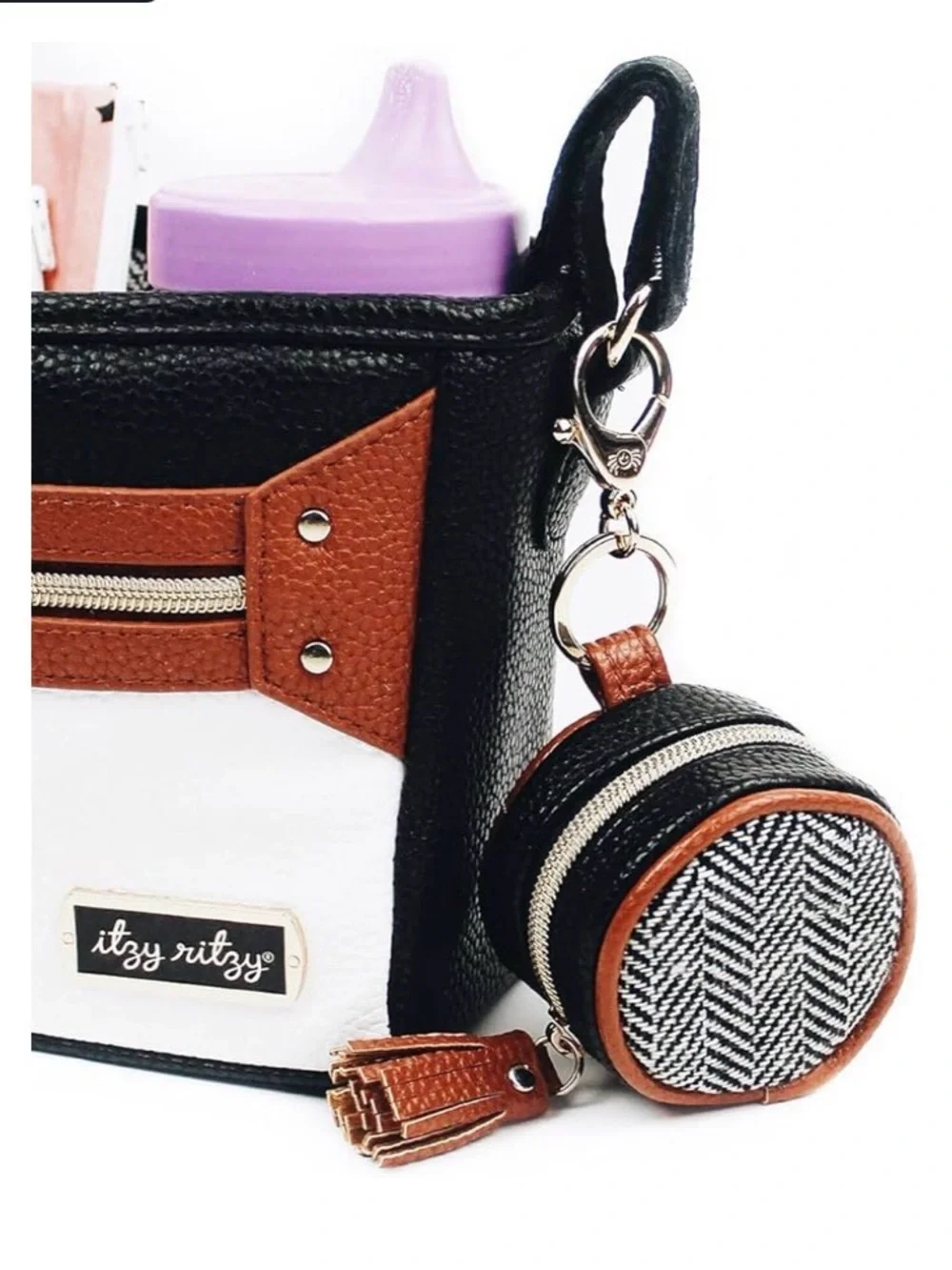 Itzy Ritzy Round Diaper Bag pod in Black, White & Brown